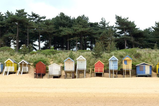 Row of colourful beach huts at Wells Next to Sea