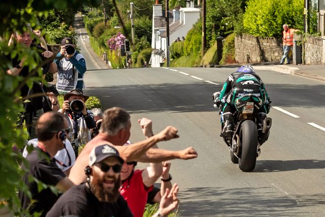 Michael Dunlop racing past fans