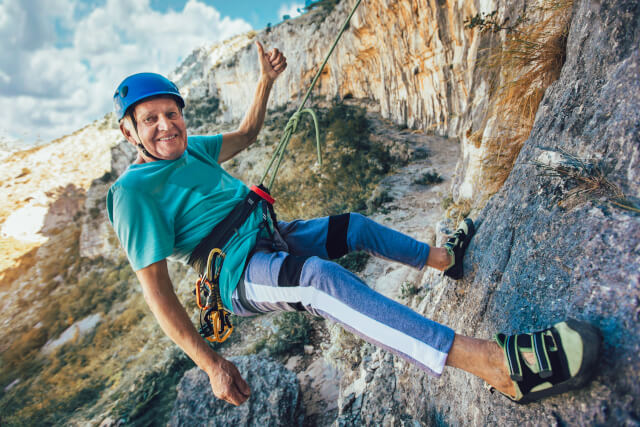 elderley man abseiling