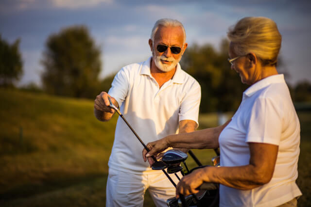 elderly couple at golf club