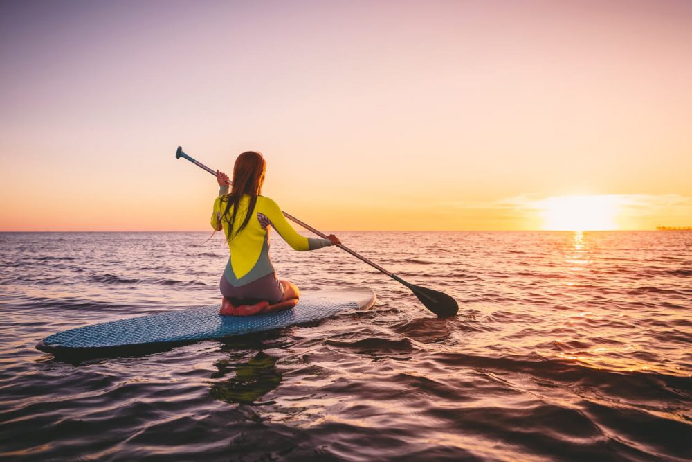 paddle boarding on the ocean